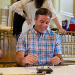 Lane & Associates dentists sitting around table laughing