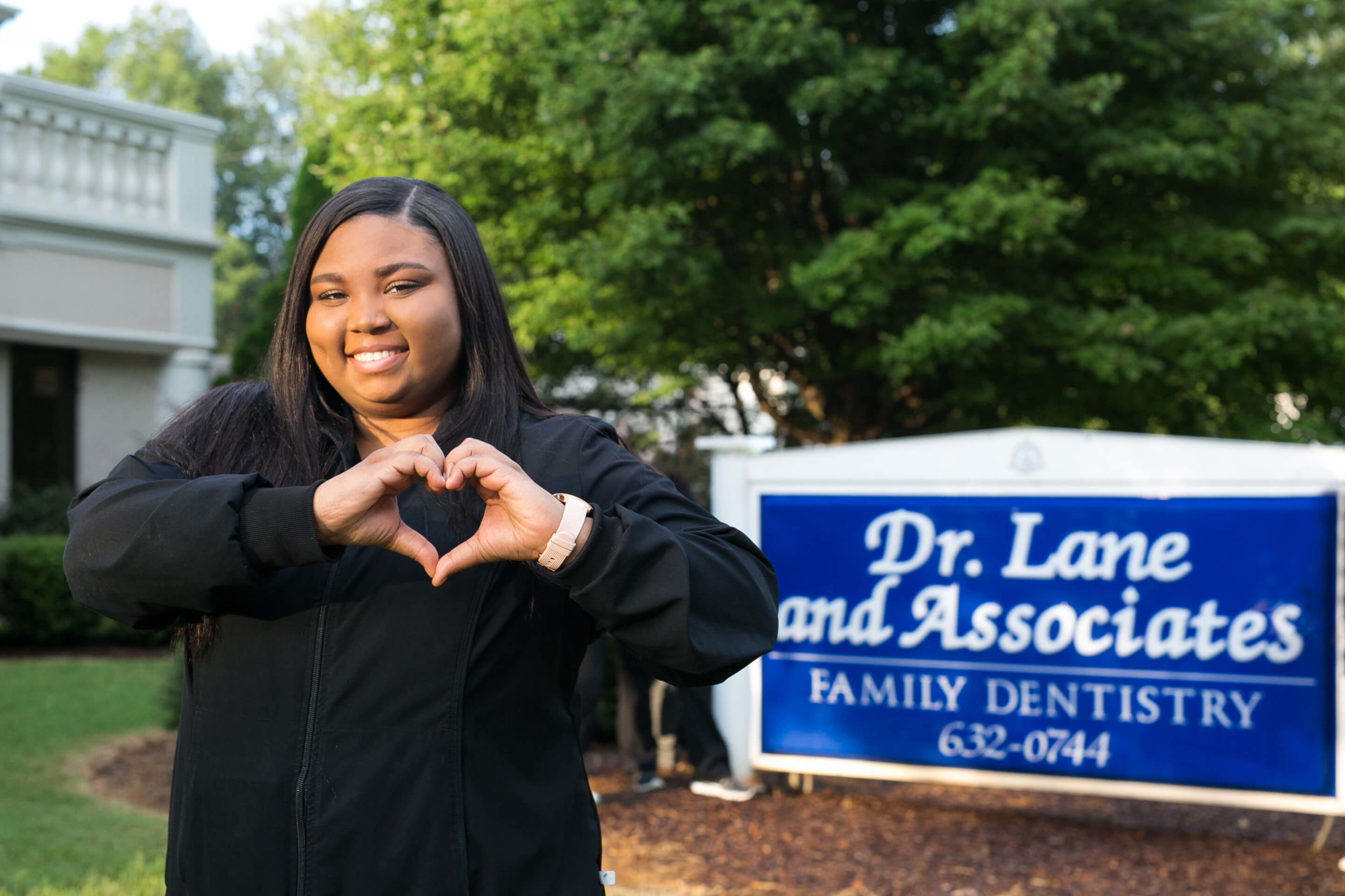 Greensboro employee making heart hands