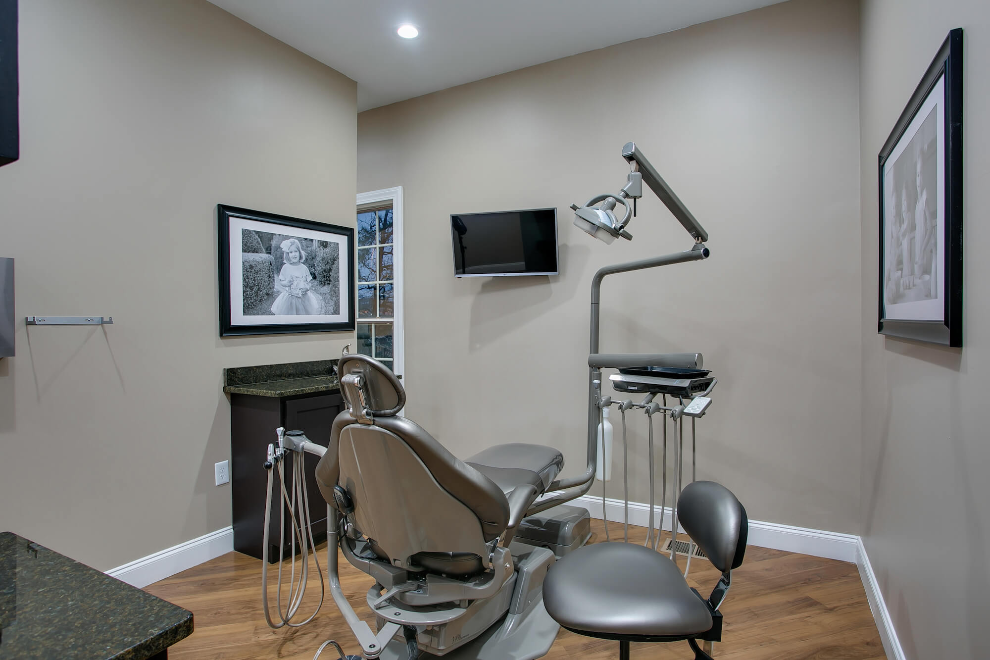 Gray metallic dental chair and operatory room in Southern Pines NC