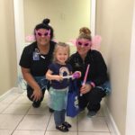 Little girl with two Lane and Associates NC Employees celebrating National Tooth Fairy Day 2018