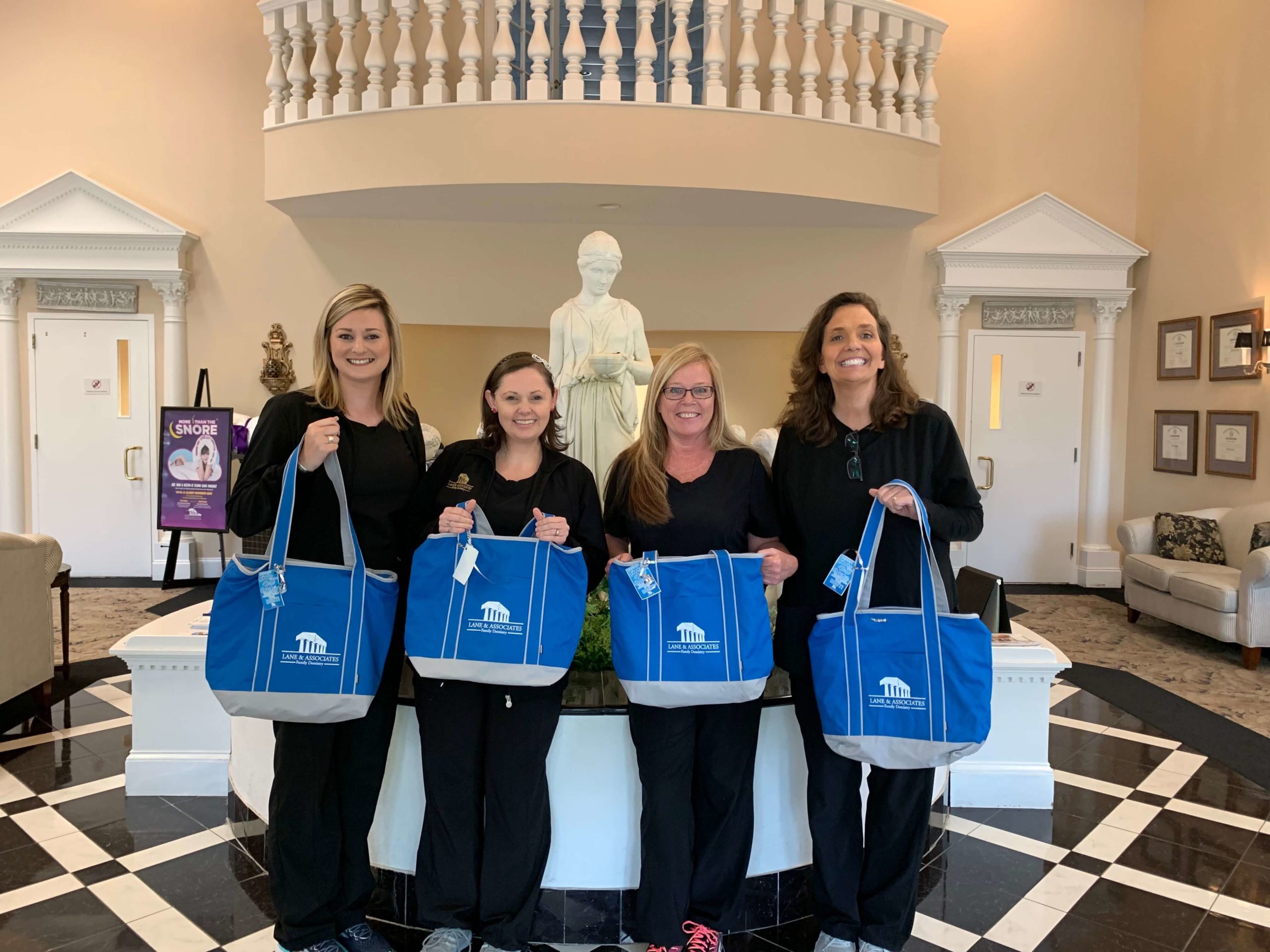 Fuquay Administrative Professionals standing with their cooler totes