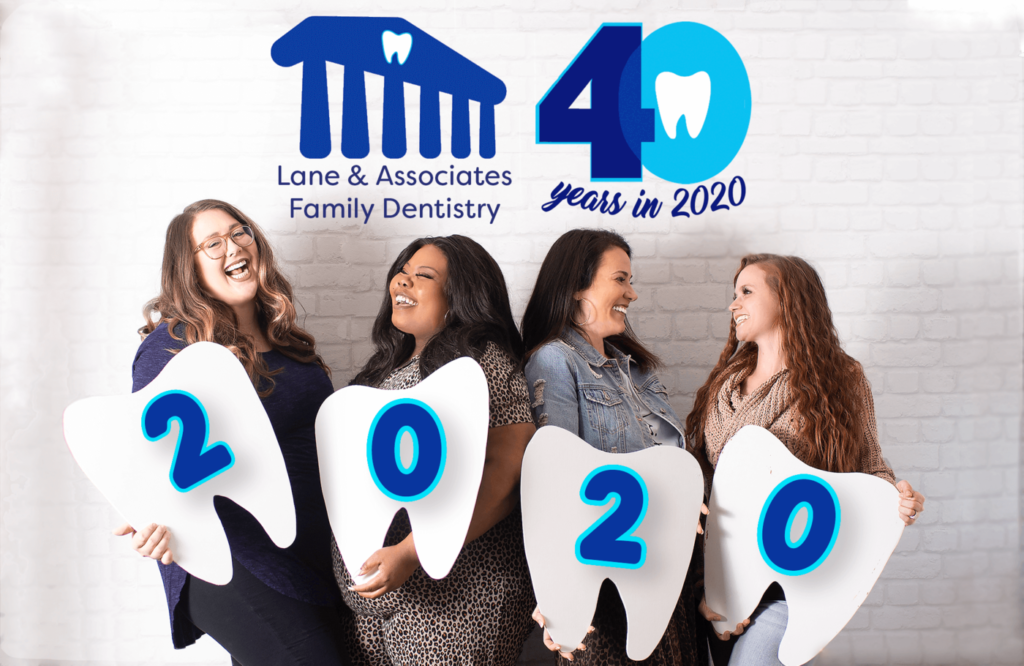 Marketing team at Lane holding 2020 signs