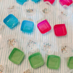 pins and needles divided into containers
