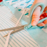 cutting out ribbons for healthcare face masks