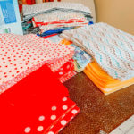 stacks of cotton fabric, red and multicolored