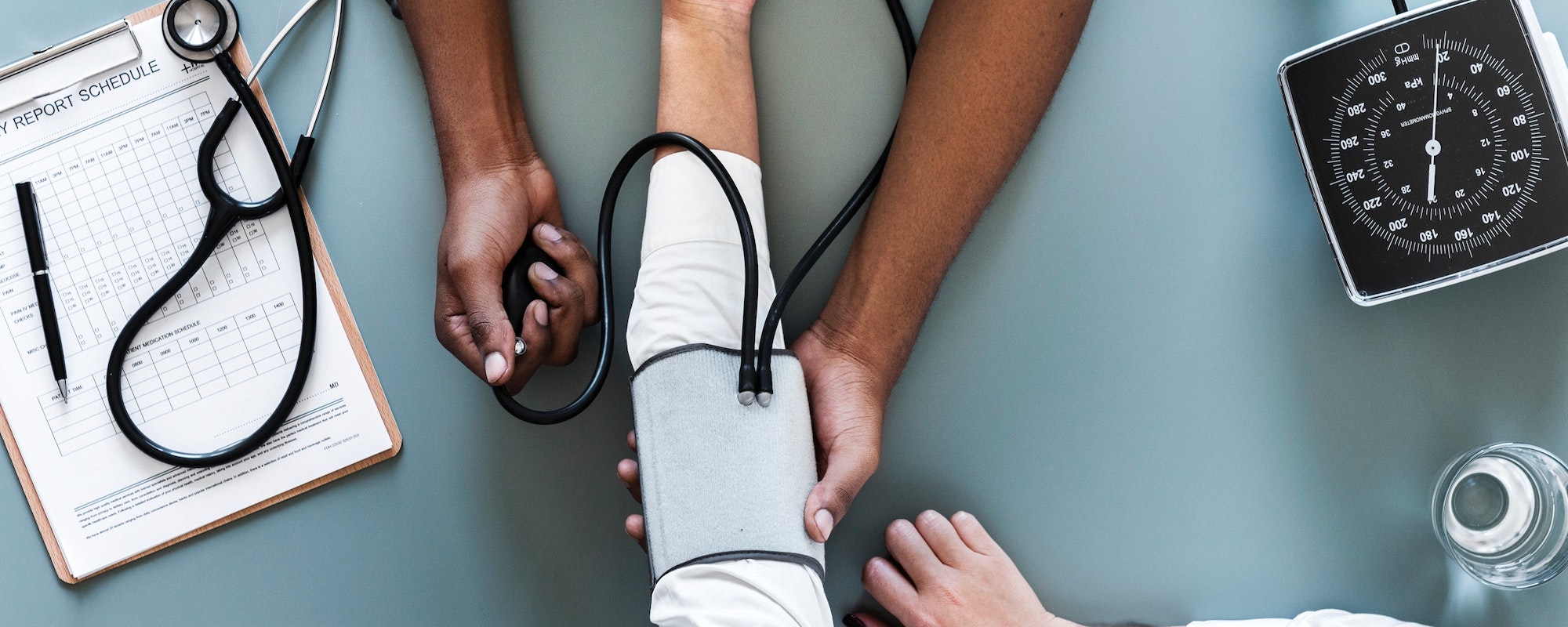staff taking patient blood pressure