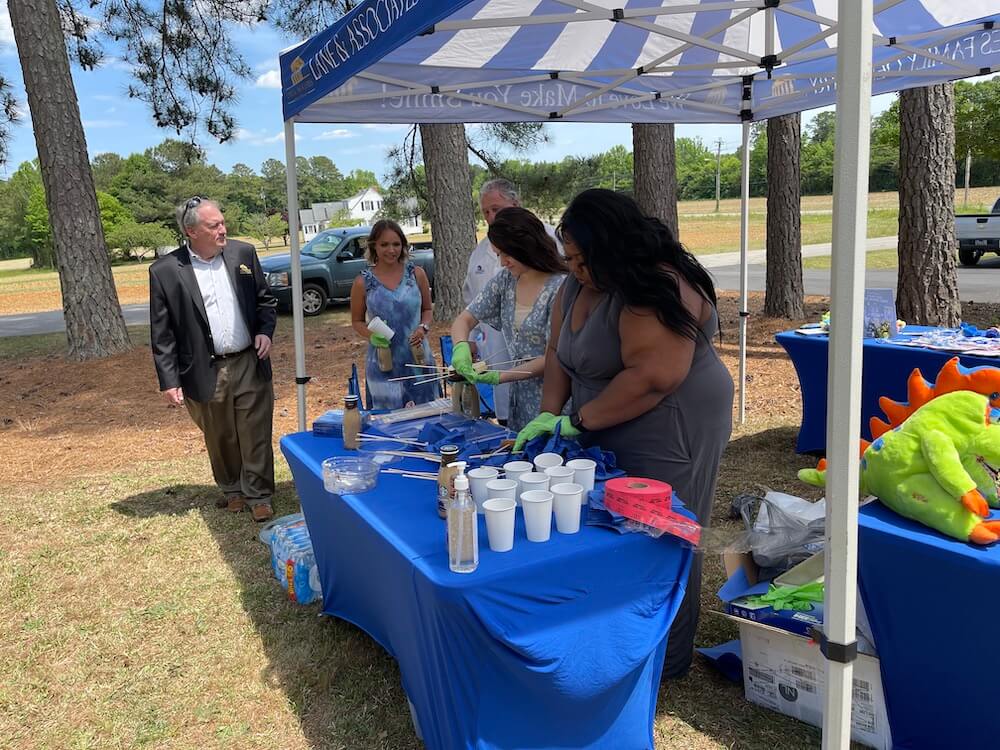 Middlesex Ribbon Cutting team making Cheesecake on a stick