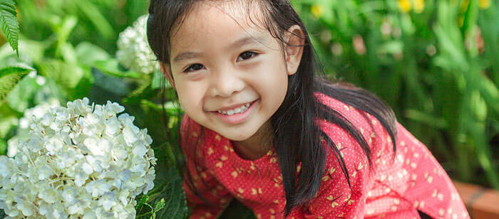 smiling little girl in garden