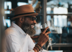 man drinking red wine