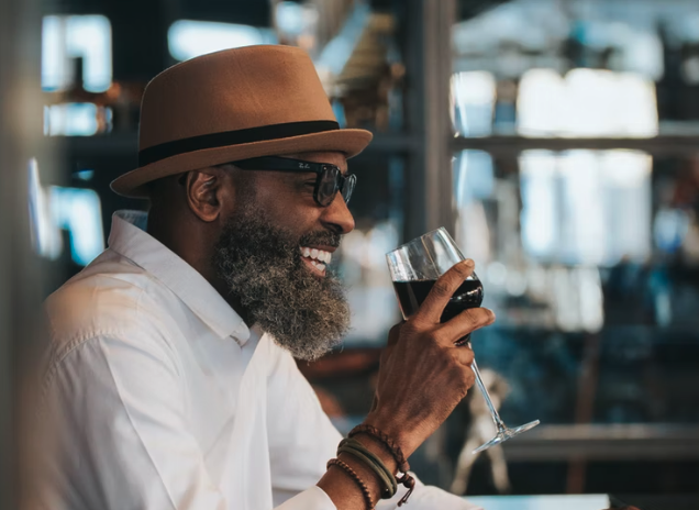 man drinking red wine
